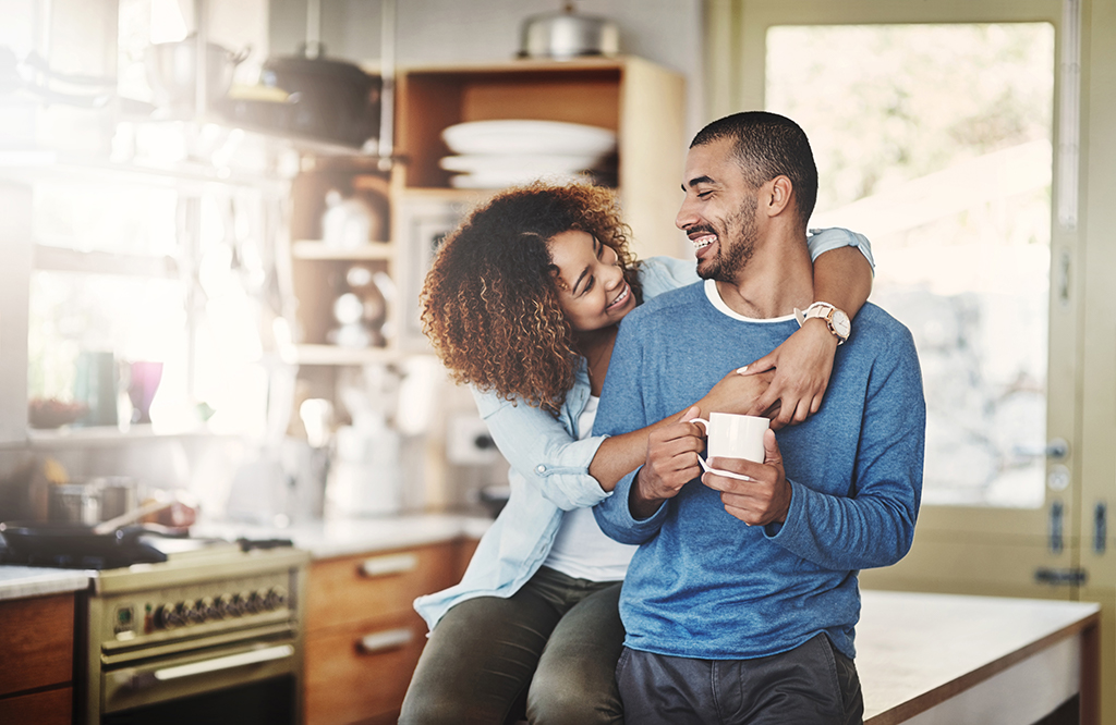 A man and woman hugging.